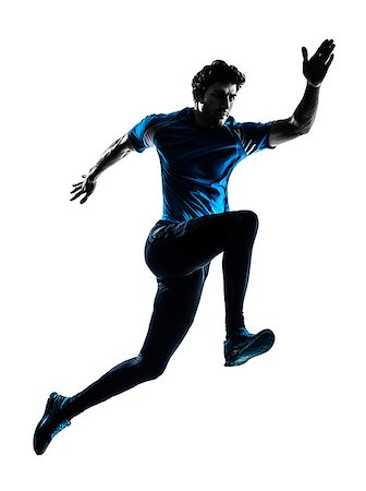 runner silhouette - one  man running sprinting jogging in silhouette studio isolated on white background Photographie de stock - Aubaine LD & Abonnement, Code: 400-07973146