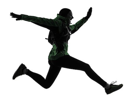 simsearch:400-06768313,k - one  woman runner running trekking in silhouette studio isolated on white background Photographie de stock - Aubaine LD & Abonnement, Code: 400-07973379