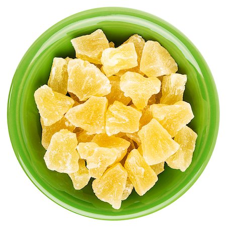 pixelsaway (artist) - chunks of dried pineapple in an isolated green ceramic bowl Foto de stock - Royalty-Free Super Valor e Assinatura, Número: 400-07973441