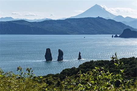 Three Brothers Rocks in Avacha Bay and Viluchinsky volcano. Russia, Far East, Kamchatka Peninsula. Stock Photo - Budget Royalty-Free & Subscription, Code: 400-07973736