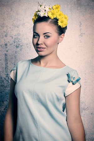 simsearch:400-07986693,k - Beautiful, romantic, fresh, spring woman with white and yellow wreath of flowers and baby blue blouse. Stock Photo - Budget Royalty-Free & Subscription, Code: 400-07984611