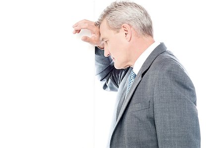 simsearch:400-04345508,k - Unhappy businessman resting his head against wall Stock Photo - Budget Royalty-Free & Subscription, Code: 400-07985019