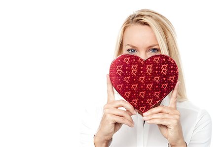 peeping fashion - Smiling woman with a gift in the form of heart in his hands Stock Photo - Budget Royalty-Free & Subscription, Code: 400-07985277