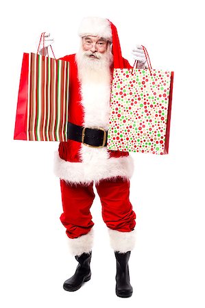 Cheerful santa claus shopping for x-mas gifts Stock Photo - Budget Royalty-Free & Subscription, Code: 400-07985472
