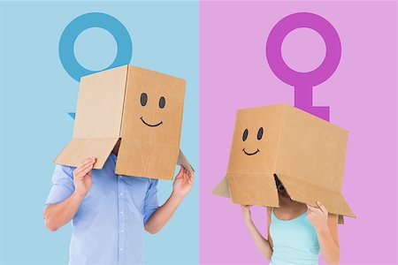 Couple wearing emoticon face boxes on their heads against female gender symbol Stock Photo - Budget Royalty-Free & Subscription, Code: 400-07986164