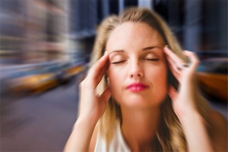 Woman with headache against blurry new york street Stock Photo - Budget Royalty-Free & Subscription, Code: 400-07986298