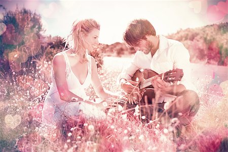 serenade - Handsome man serenading his girlfriend with guitar on a sunny day Stock Photo - Budget Royalty-Free & Subscription, Code: 400-07986351