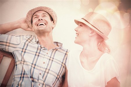 Young hip couple laughing on bench on a sunny day in the city Stock Photo - Budget Royalty-Free & Subscription, Code: 400-07986379