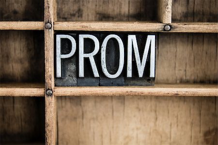 The word "PROM" written in vintage metal letterpress type in a wooden drawer with dividers. Stock Photo - Budget Royalty-Free & Subscription, Code: 400-07986853