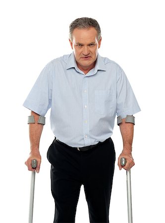 simsearch:400-07976358,k - Angry aged man with crutches looking at you. All on white background Stock Photo - Budget Royalty-Free & Subscription, Code: 400-07987656