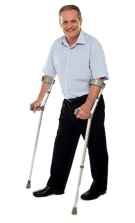 simsearch:400-07987656,k - Senior man standing with the help of crutches. Recovering from an accident Stock Photo - Budget Royalty-Free & Subscription, Code: 400-07987653