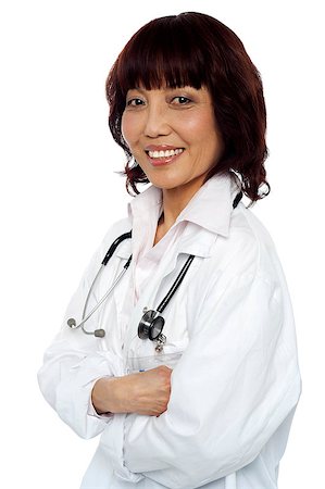 simsearch:400-08131186,k - Smiling medical expert posing with arms crossed. Stethoscope around her neck Stock Photo - Budget Royalty-Free & Subscription, Code: 400-07988478