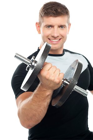 simsearch:400-06859184,k - Cheerful young gym instructor posing with heavy dumbbell over white background Photographie de stock - Aubaine LD & Abonnement, Code: 400-07988605