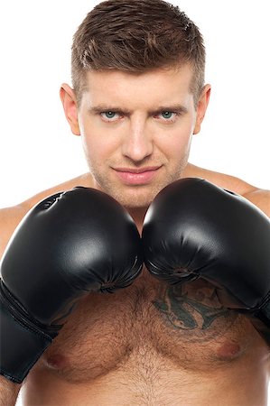Close up picture of young caucasian boxer with tattoo on his chest Stock Photo - Budget Royalty-Free & Subscription, Code: 400-07988620