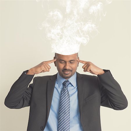 simsearch:400-04850746,k - Businessman head burnout, smoke coming out from head. Photographie de stock - Aubaine LD & Abonnement, Code: 400-07989079