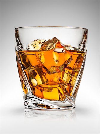 Glass of whiskey on a gray background Stock Photo - Budget Royalty-Free & Subscription, Code: 400-07989154