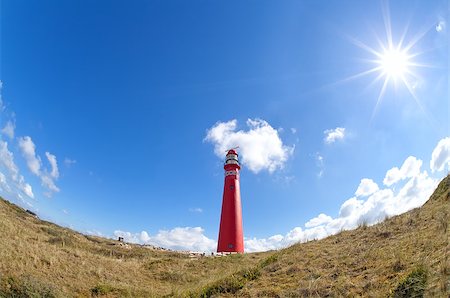 sun shining over red lighthouse, Schiermonnikoog island, Netherlands Stock Photo - Budget Royalty-Free & Subscription, Code: 400-07980334