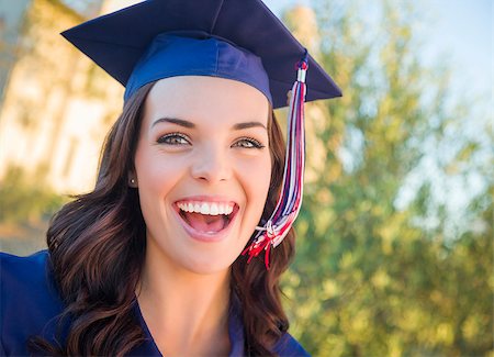 Happy Graduating Mixed Race Woman In Cap and Gown Celebrating on Campus. Stock Photo - Budget Royalty-Free & Subscription, Code: 400-07981126