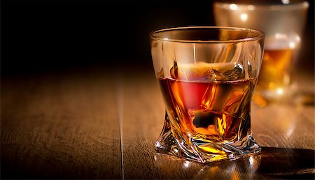 Glasses of whiskey on a wooden table Stockbilder - Microstock & Abonnement, Bildnummer: 400-07981300