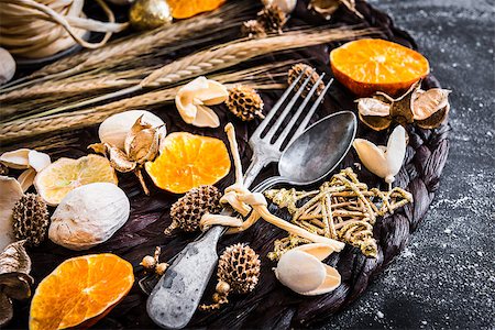 fork and spoon with Christmas decorations on a black textured table Stock Photo - Budget Royalty-Free & Subscription, Code: 400-07981344