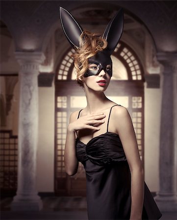 simsearch:400-06557487,k - Sexy, lovely, charming woman in black bunny carnival mask and dress. She has got nice make up and curly hair. Stock Photo - Budget Royalty-Free & Subscription, Code: 400-07981356