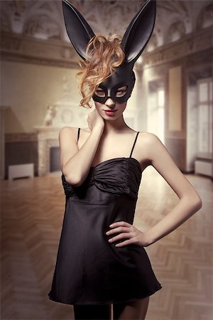 simsearch:400-06557487,k - Charming, sexy Easter, black bunny in black,satin dress, red lips and wild, red hair. Stock Photo - Budget Royalty-Free & Subscription, Code: 400-07981352