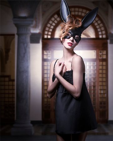simsearch:400-07254895,k - Carnival, sexy woman in bunny mask, black dress. She has got wild, curly hairstyle and nice makeup. Stock Photo - Budget Royalty-Free & Subscription, Code: 400-07981353
