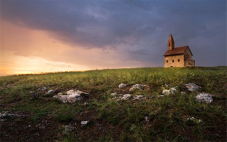 simsearch:400-08317924,k - Old Roman Catholic Church of St. Michael the Archangel on the Hill at Sunset in Drazovce, Slovakia Stock Photo - Budget Royalty-Free & Subscription, Code: 400-07982394