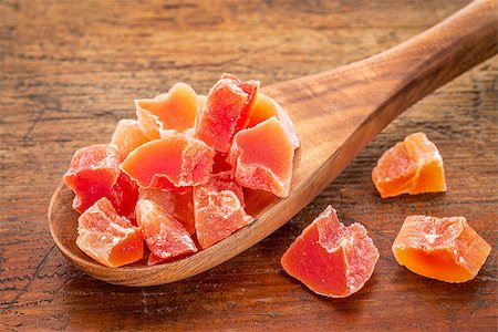 simsearch:400-08334670,k - chunks of dried papaya fruit on a wooden spoon against grunge wood background Stock Photo - Budget Royalty-Free & Subscription, Code: 400-07982850