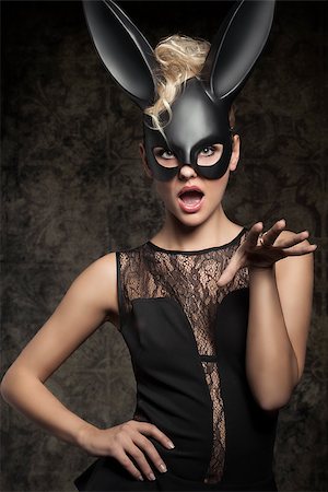 simsearch:400-07254895,k - Sexy, beautiful, charming woman in black dress and carnival black rabbit mask in funny pose. Stock Photo - Budget Royalty-Free & Subscription, Code: 400-07982869