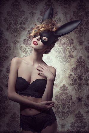 simsearch:400-07981805,k - Dark easter portrait of sensual curly woman with romantic expression posing with mysterious bunny mask and lace lingerie Stock Photo - Budget Royalty-Free & Subscription, Code: 400-07983424