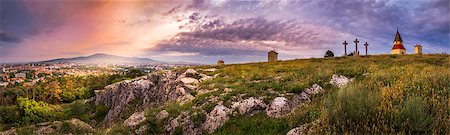 City and Village under a Hill at Sunset as Seen from Calvary, Nitra, Slovakia. Meadow with Flowers and Rocks in Foreground. Stock Photo - Budget Royalty-Free & Subscription, Code: 400-07983454