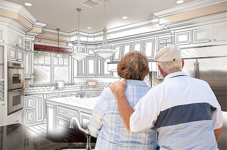 simsearch:400-08772366,k - Senior Couple Looking Over Custom Kitchen Design Drawing and Photo Combination. Stock Photo - Budget Royalty-Free & Subscription, Code: 400-07983721