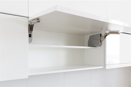 simsearch:400-06694997,k - opened white kitchen cabinet with empty shelf Stock Photo - Budget Royalty-Free & Subscription, Code: 400-07983993