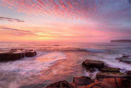 simsearch:400-07514503,k - Summer sunrise skies  light up with colour throwing warmth across the  landscape and whitewater seas wash around the rocks at North Avoca Central Coast NSW Australia Stock Photo - Budget Royalty-Free & Subscription, Code: 400-07994017