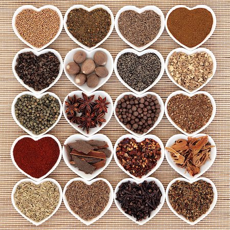 Middle eastern spice selection in heart shaped porcelain bowls. Stockbilder - Microstock & Abonnement, Bildnummer: 400-07994165