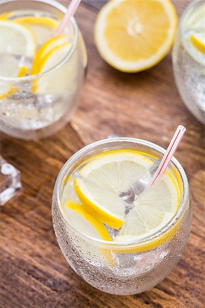 simsearch:400-07555096,k - Glass of cold fresh lemonade on a wooden table Stock Photo - Budget Royalty-Free & Subscription, Code: 400-07994272