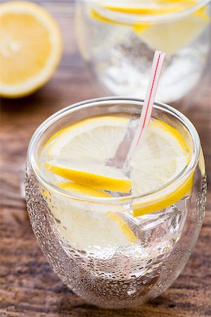 simsearch:400-07555096,k - Glass of cold fresh lemonade on a wooden table Stock Photo - Budget Royalty-Free & Subscription, Code: 400-07994273