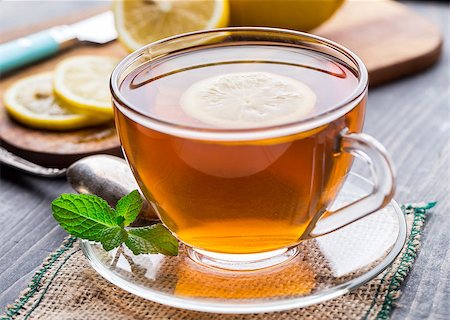 simsearch:400-06554630,k - Cup of tea with mint and lemon on wooden table Stock Photo - Budget Royalty-Free & Subscription, Code: 400-07994662