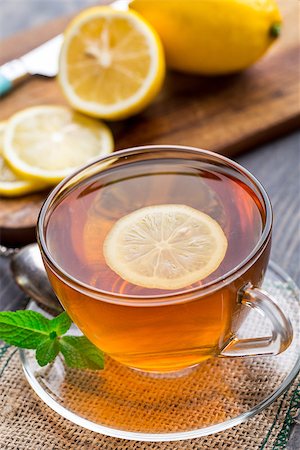 simsearch:400-06554630,k - Cup of tea with mint and lemon on wooden table Stock Photo - Budget Royalty-Free & Subscription, Code: 400-07994796