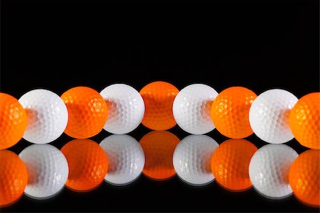 simsearch:400-07218299,k - Golf balls on the black glass table Stock Photo - Budget Royalty-Free & Subscription, Code: 400-07994924
