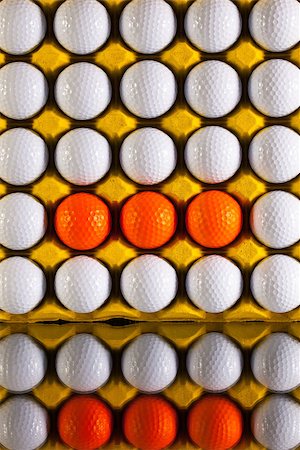 White and orange golf balls in paper carton for eggs Stock Photo - Budget Royalty-Free & Subscription, Code: 400-07994922