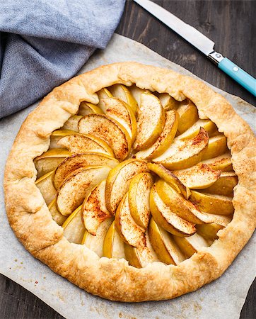 Apple galette with cinnamon on a parchment Stock Photo - Budget Royalty-Free & Subscription, Code: 400-07995163