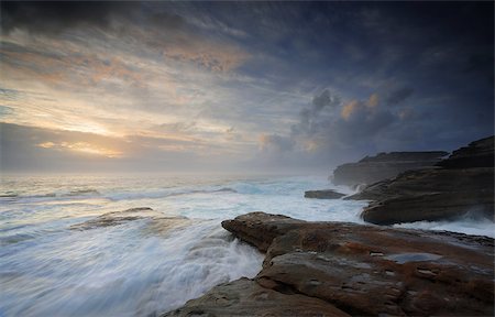 simsearch:400-07667033,k - Turbulent ocean currents build unabated like unbridled passions washing over steadfast rocks that do not surrender  but stands firm.   Little Bay, NSW Australia Stock Photo - Budget Royalty-Free & Subscription, Code: 400-07995680