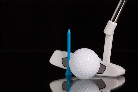 simsearch:400-07218310,k - Golf putter and different golf equipments on the black glass desk Fotografie stock - Microstock e Abbonamento, Codice: 400-07995757