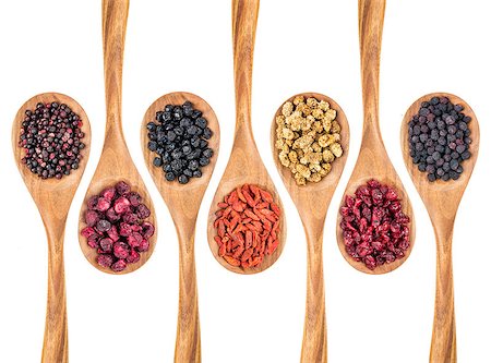 simsearch:400-08334670,k - healthy dried berry collection (blueberry, mulberry, cherry, goji, elderberry, chokeberry, cranberry) on isolated wooden spoons, top view Stock Photo - Budget Royalty-Free & Subscription, Code: 400-07997064