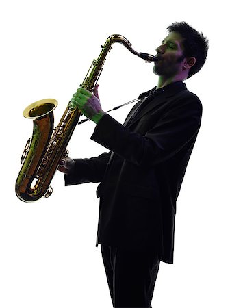 photos of man playing saxophone - one caucasian man  saxophonist playing saxophone player in studio silhouette isolated on white background Stock Photo - Budget Royalty-Free & Subscription, Code: 400-07990348