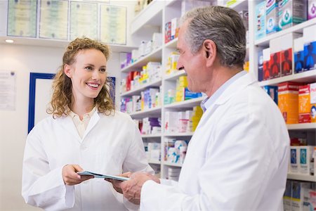 Team of pharmacist holding clipboard at hospital pharmacy Stock Photo - Budget Royalty-Free & Subscription, Code: 400-07990533