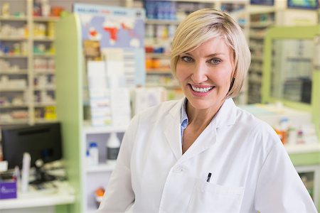 Pharmacist smiling at camera at the hospital pharmacy Stock Photo - Budget Royalty-Free & Subscription, Code: 400-07990595
