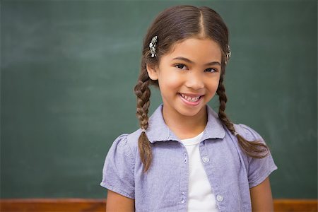 simsearch:400-07991158,k - Smiling pupil looking at camera at elementary school Stock Photo - Budget Royalty-Free & Subscription, Code: 400-07990992